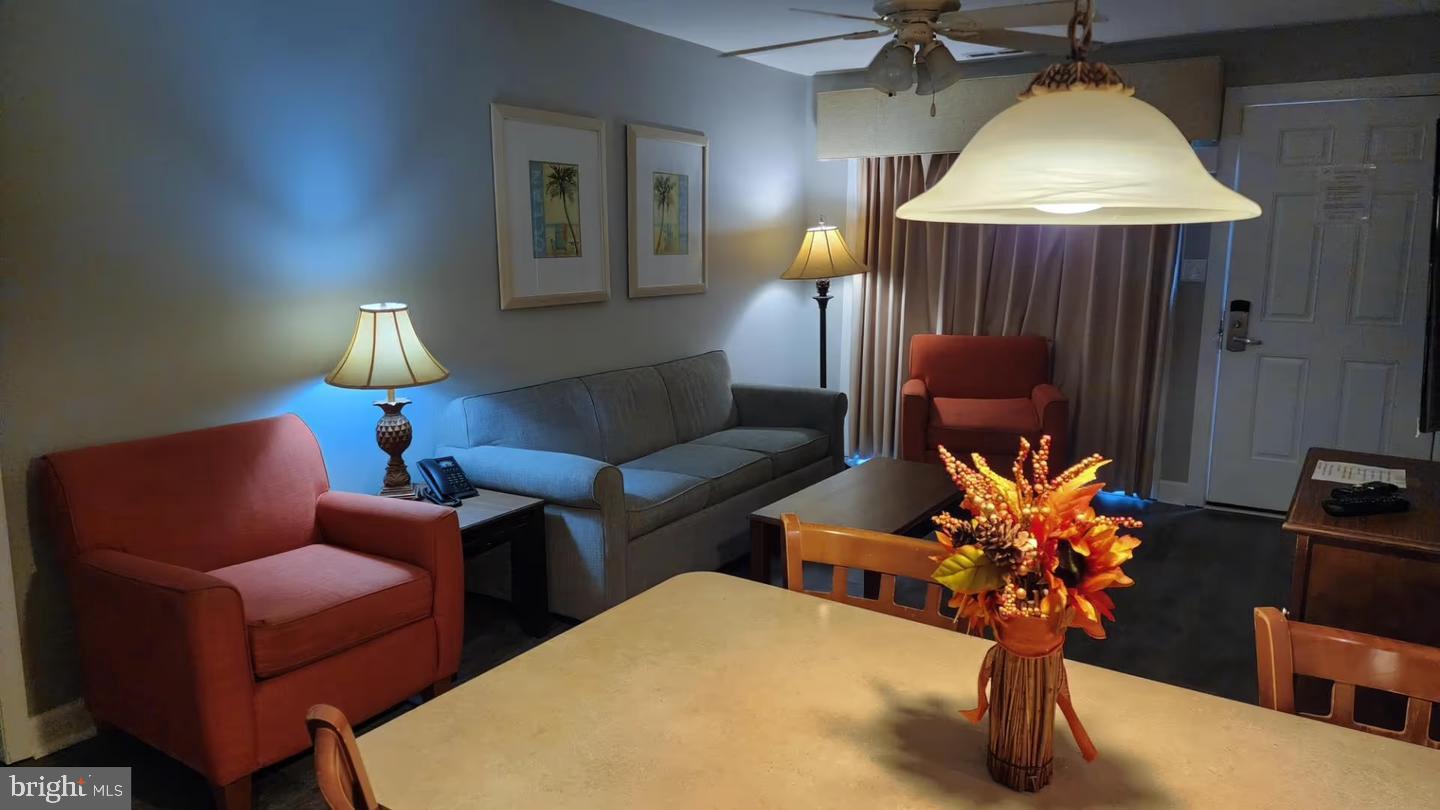 105 Edward Taylor Road, Unit 251 36 Ocean City, MD 21842 - Photo 13 of 21 a living room with furniture flowerpot and a chandelier
