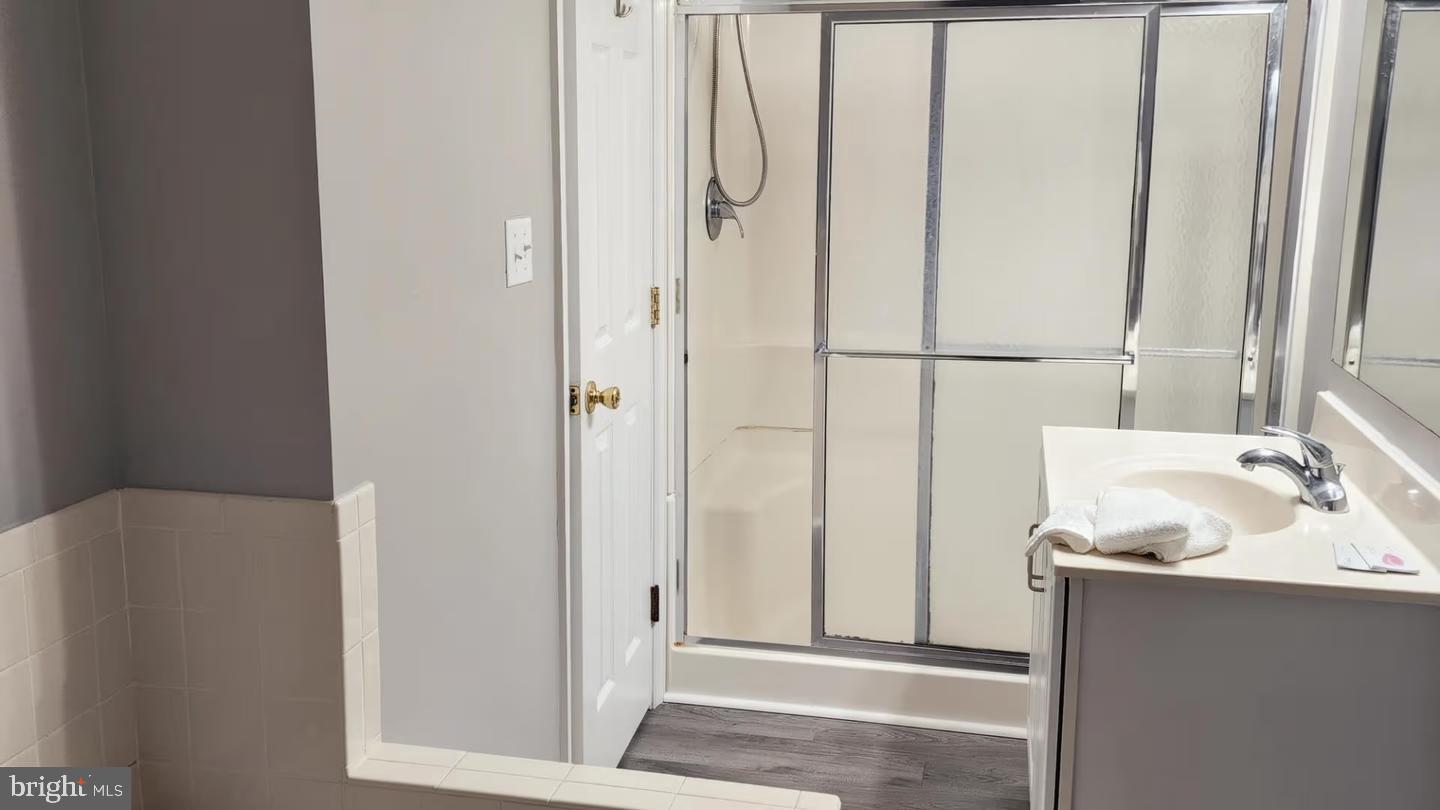 105 Edward Taylor Road, Unit 251 36 Ocean City, MD 21842 - Photo 21 of 21 a bathroom with a sink and a mirror