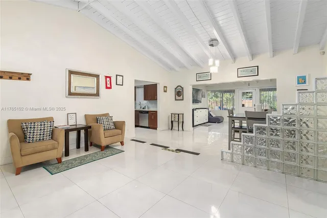 a bathroom with a sink a mirror and a shower