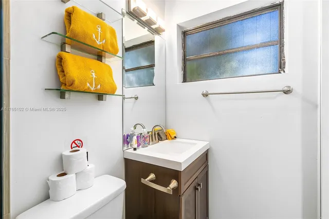 a bedroom with a bed and dresser