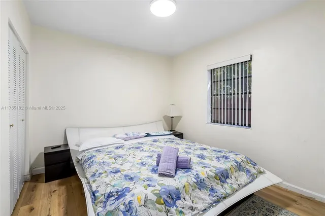 a bedroom with a bed and closet