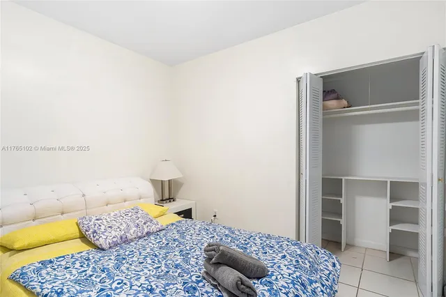 a view of backyard with table and chairs and wooden fence