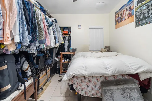 a view of dining room with furniture and floor to ceiling window