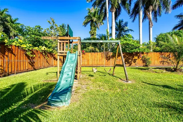 a view of a park with plants and trees