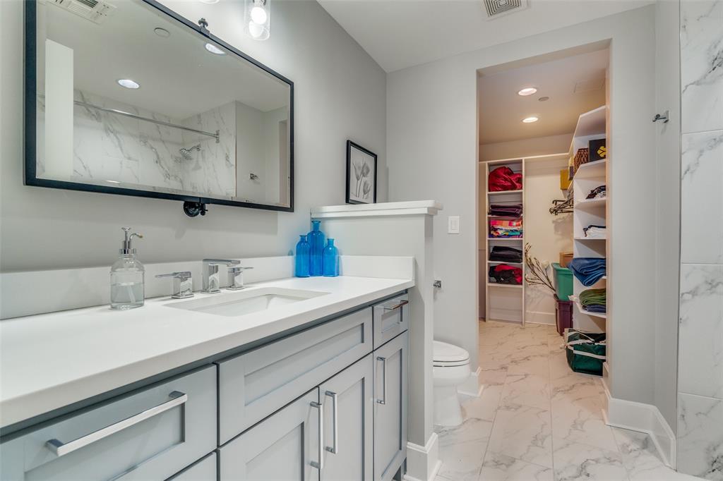 1505 Elm Street, Unit 1504 Dallas, TX 75201 - Photo 23 of 33 Full bathroom with light marble finish flooring, vanity, a marble finish shower, a spacious closet, and recessed lighting