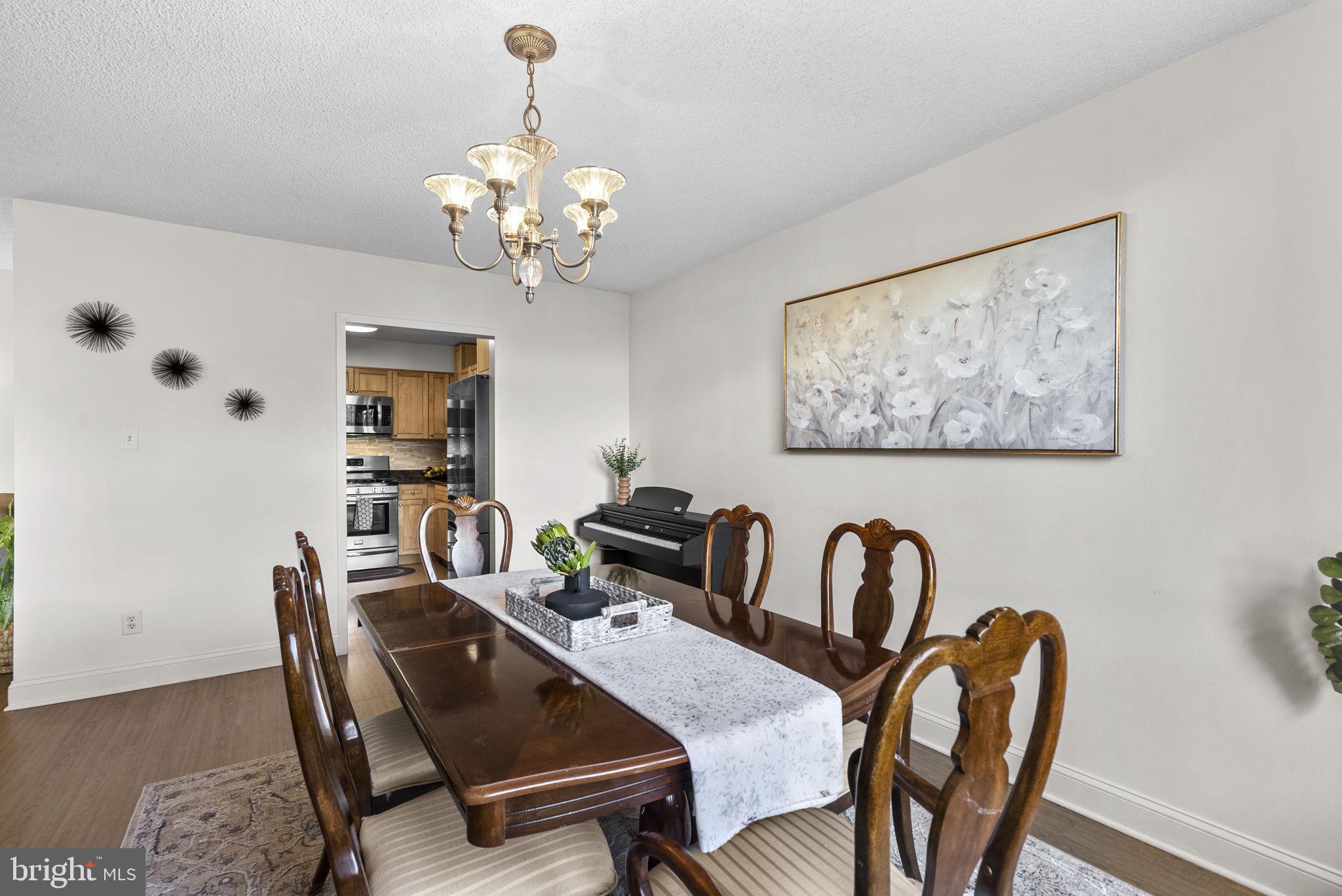 5225 Pooks Hill Road, Unit 804N Bethesda, MD 20814 - Photo 11 of 39 a dining room with furniture and window
