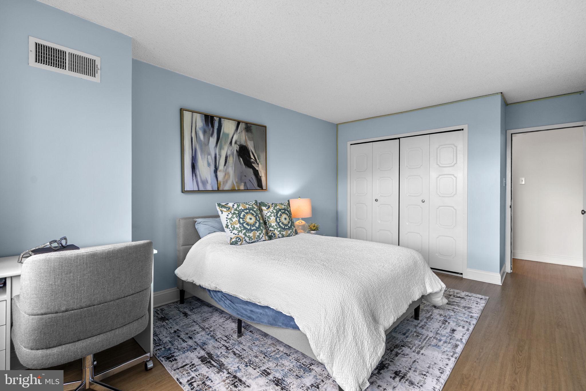 5225 Pooks Hill Road, Unit 804N Bethesda, MD 20814 - Photo 24 of 39 a bedroom with a bed and a dresser in it