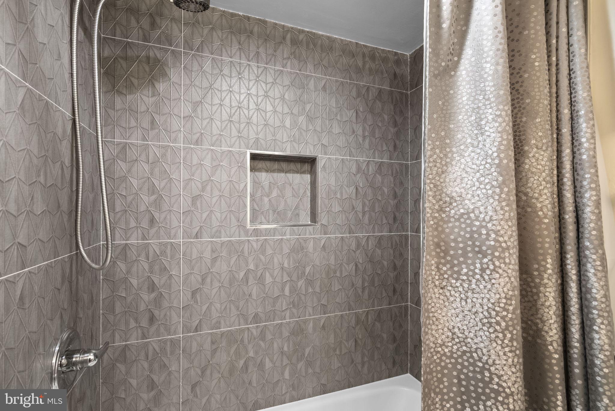 5225 Pooks Hill Road, Unit 804N Bethesda, MD 20814 - Photo 26 of 39 a bathroom with a shower