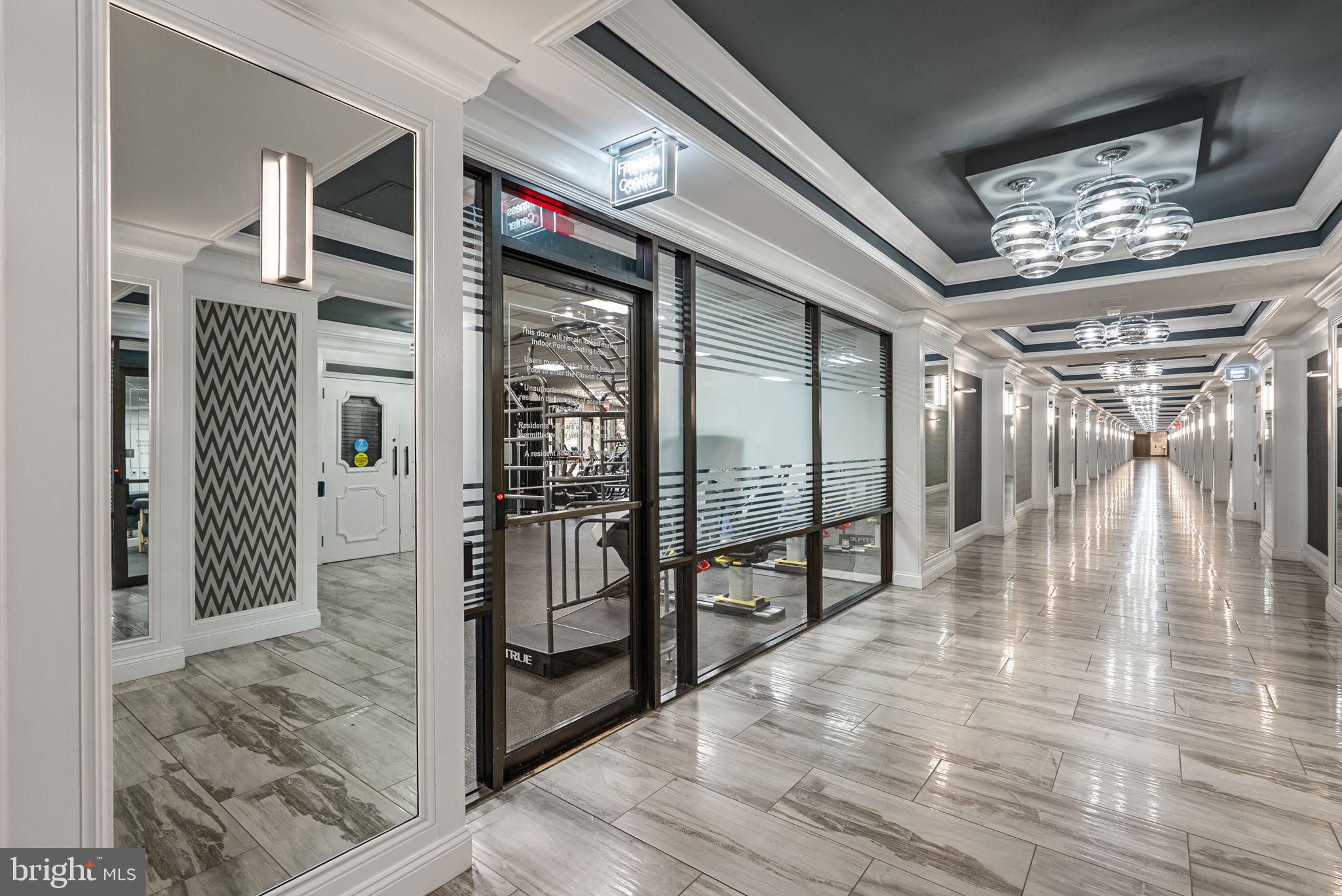 5225 Pooks Hill Road, Unit 804N Bethesda, MD 20814 - Photo 31 of 39 a view of entryway bedroom and hall with wooden floor