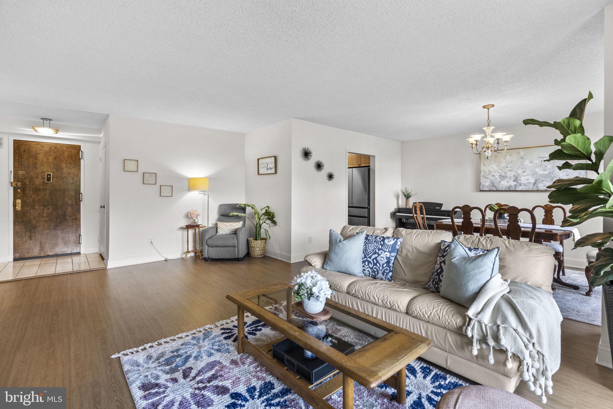 5225 Pooks Hill Road, Unit 804N Bethesda, MD 20814 - Photo 7 of 39 a living room with furniture and wooden floor