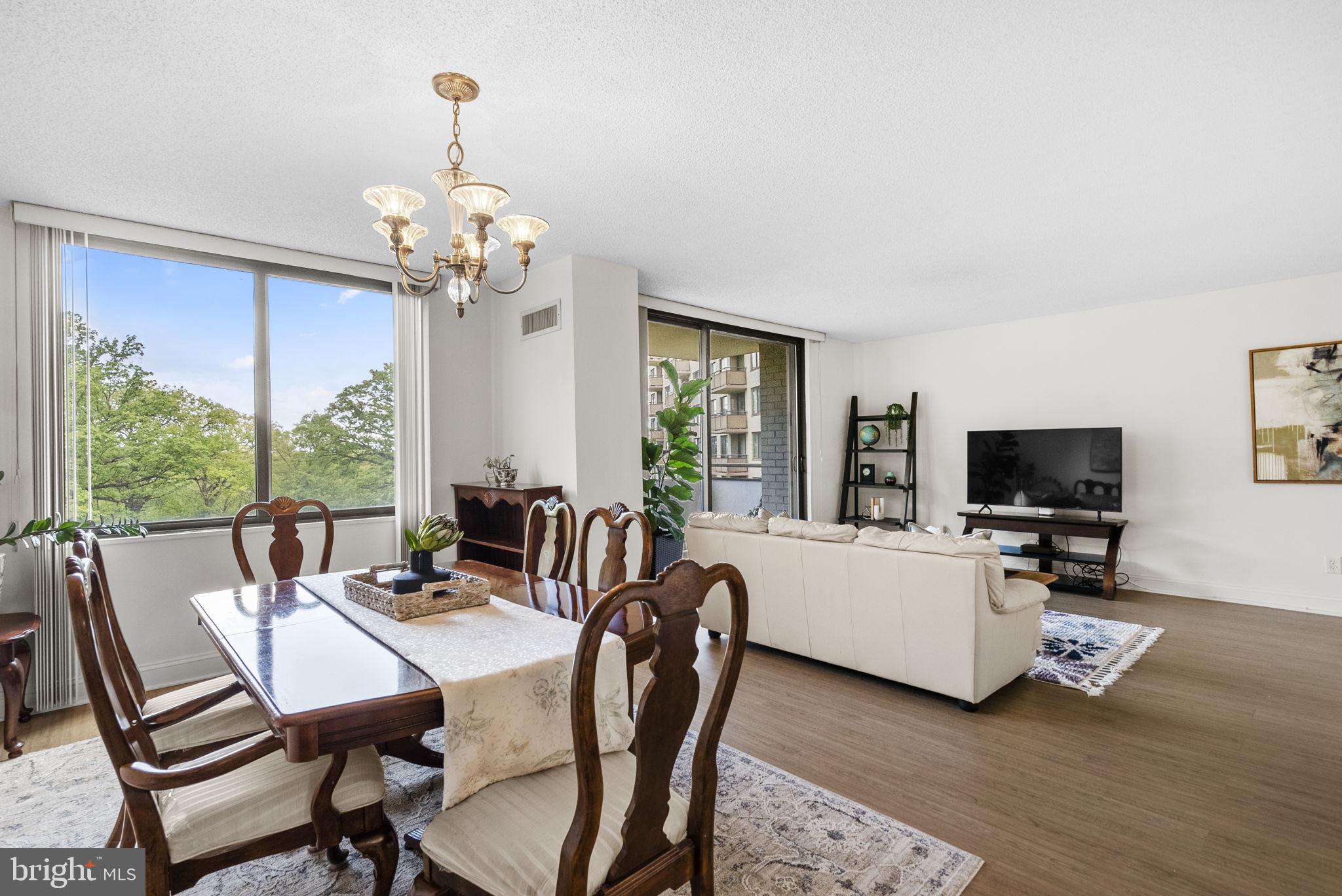 5225 Pooks Hill Road, Unit 804N Bethesda, MD 20814 - Photo 9 of 39 a view of a dining room with furniture window and wooden floor
