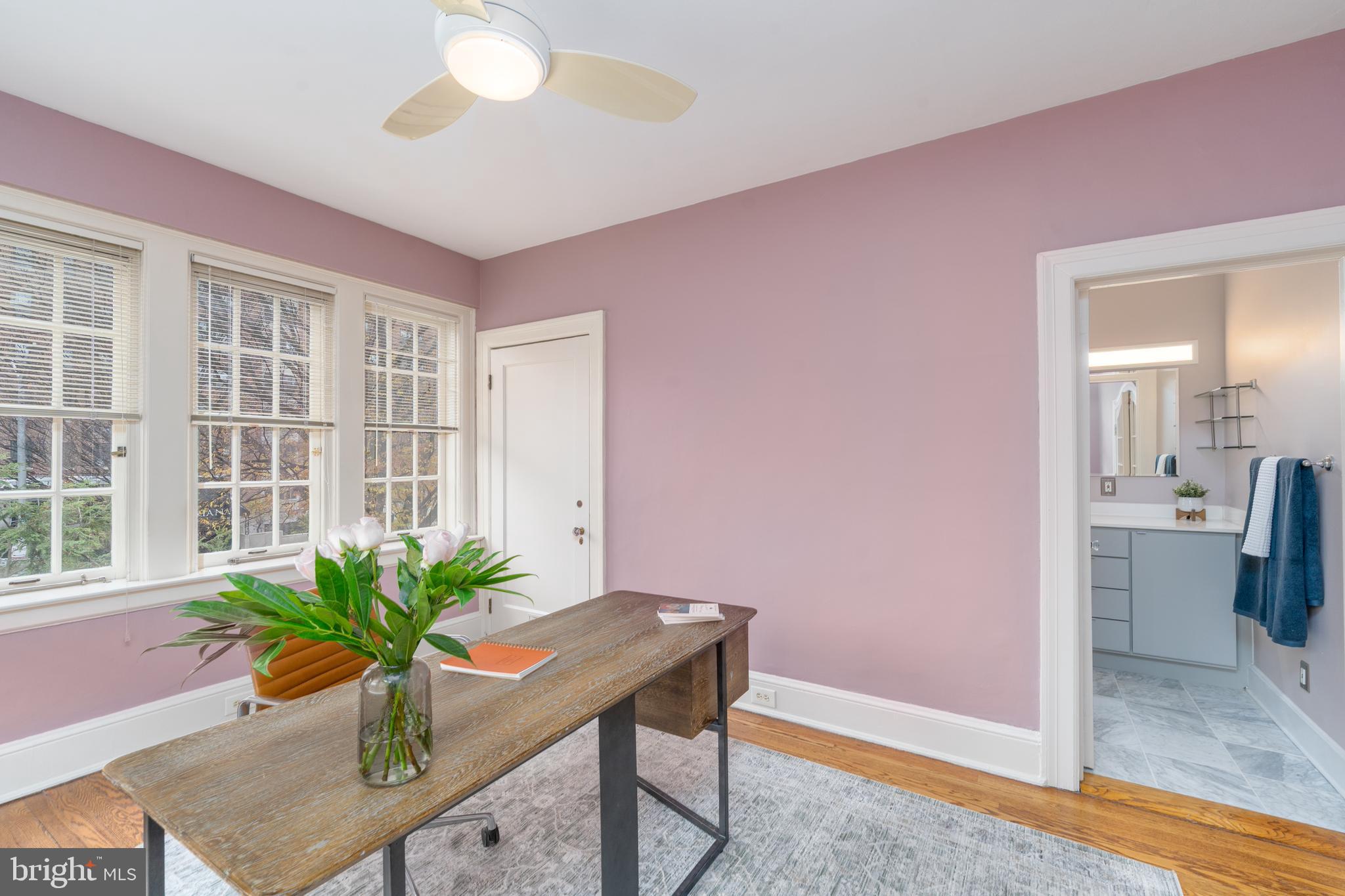 102 West 39th Street, Unit 2B Baltimore, MD 21210 - Photo 14 of 30 a room with furniture and a potted plant
