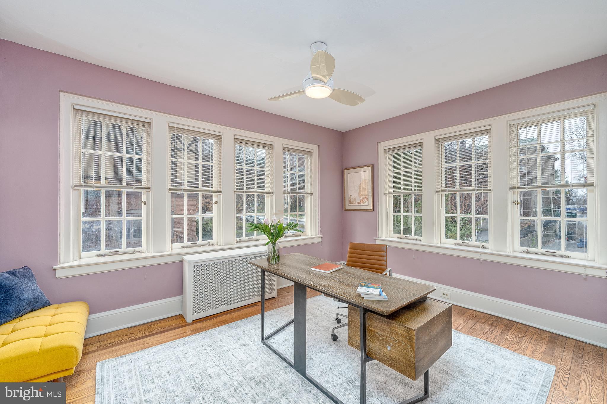 102 West 39th Street, Unit 2B Baltimore, MD 21210 - Photo 16 of 30 a living room with furniture and a window