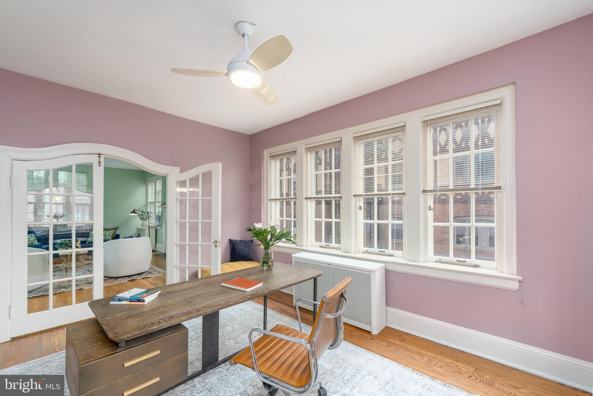 102 West 39th Street, Unit 2B Baltimore, MD 21210 - Photo 17 of 30 a living room with furniture and a window