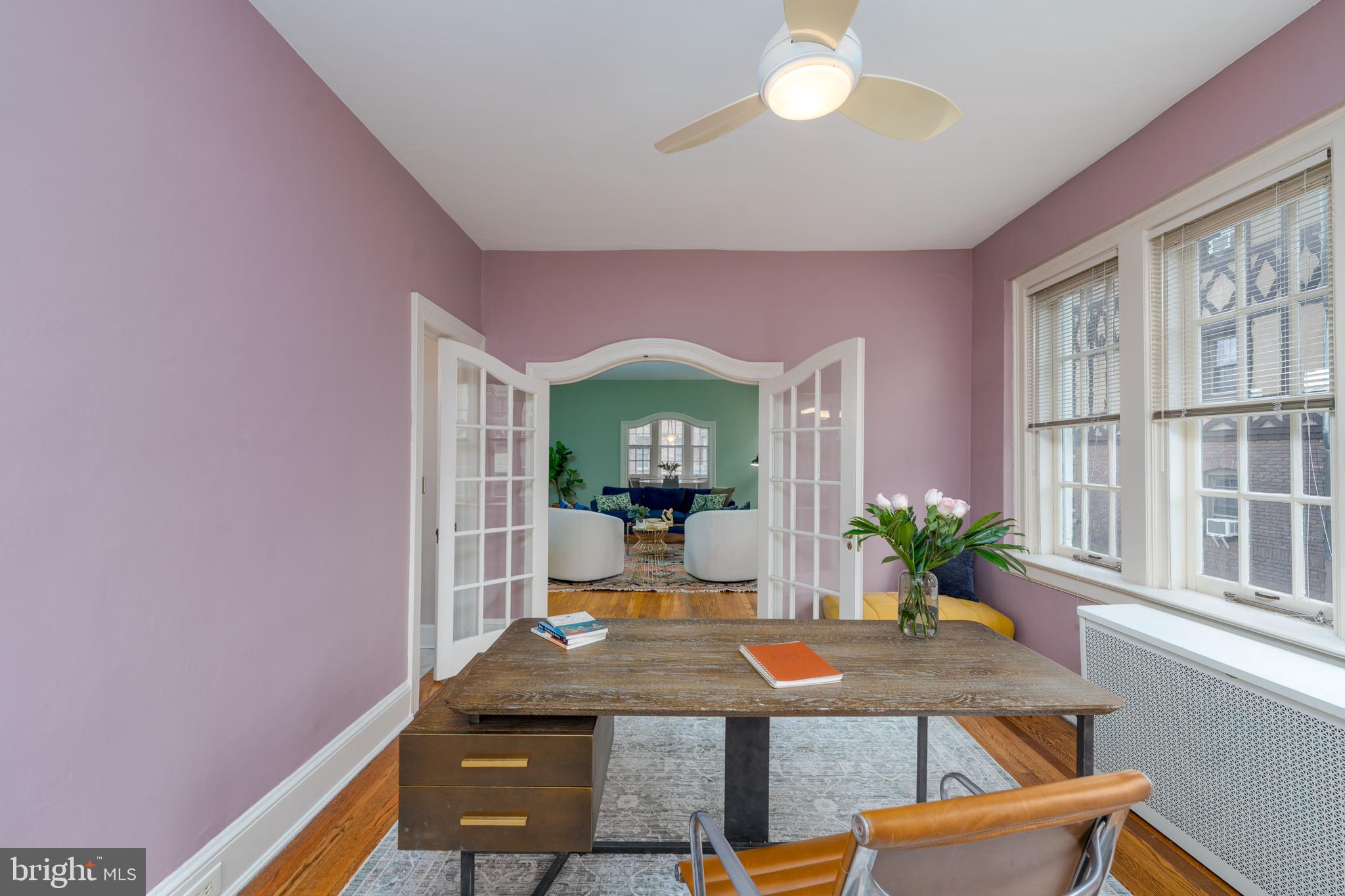 102 West 39th Street, Unit 2B Baltimore, MD 21210 - Photo 18 of 30 a room with furniture and a potted plant