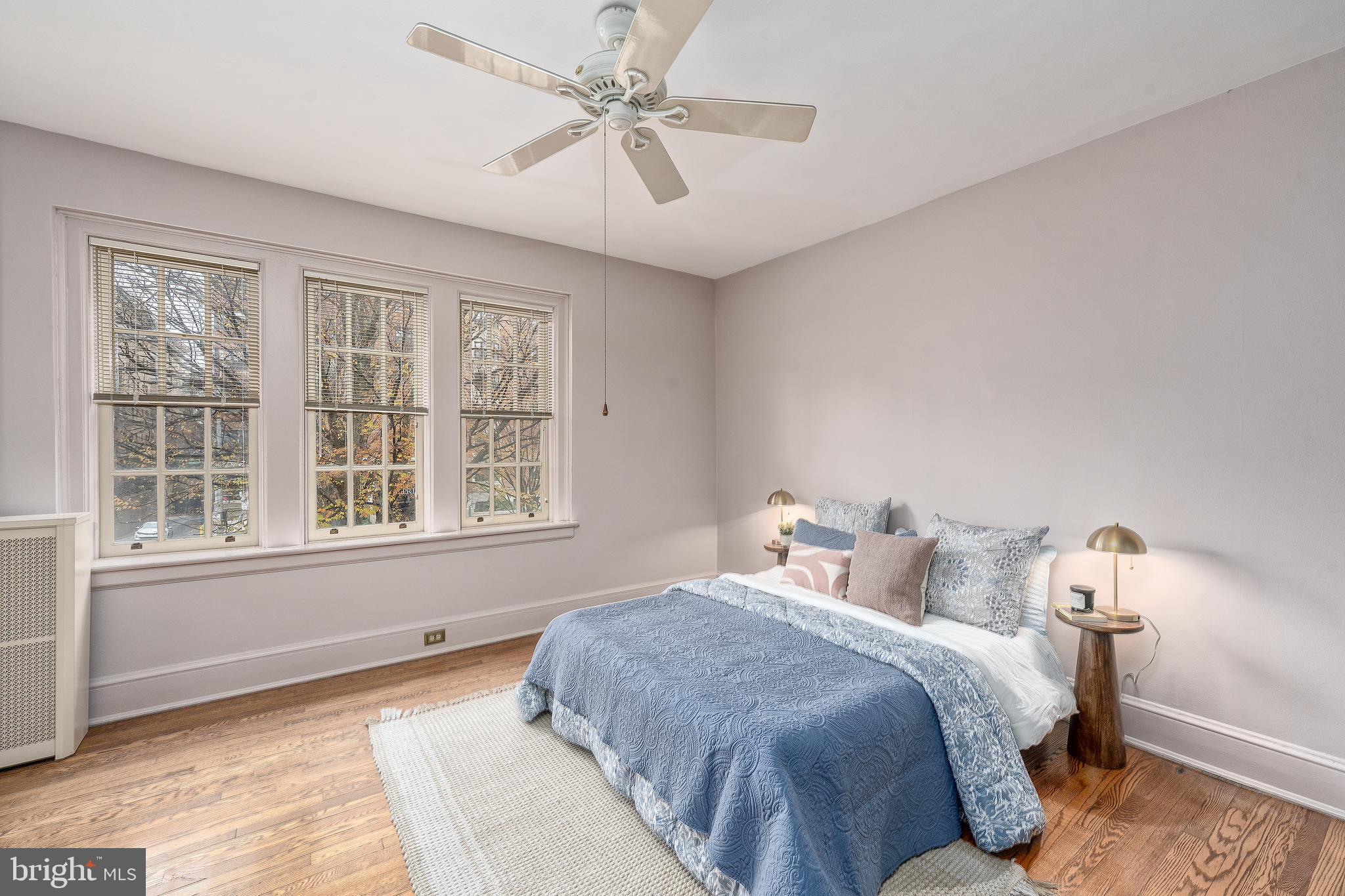 102 West 39th Street, Unit 2B Baltimore, MD 21210 - Photo 24 of 30 a bedroom with a large bed and a window