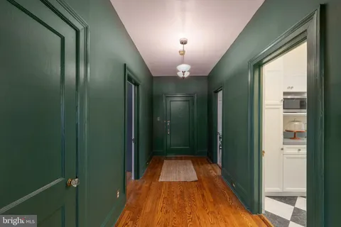 a view of a hallway with a chandelier