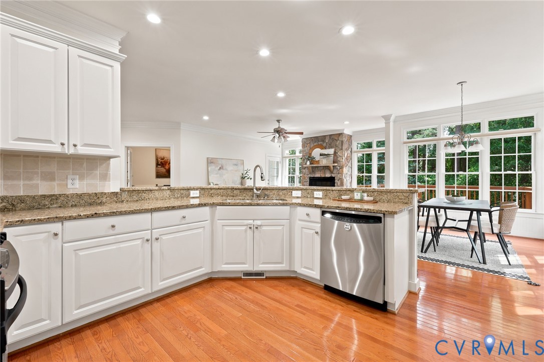 4701 Regal Oaks Road Glen Allen, VA 23059 - Photo 10 of 60 a kitchen with granite countertop white cabinets and white appliances