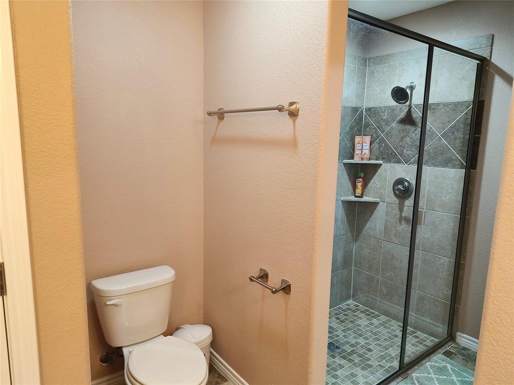 100 East Bluebonnet Drive Cresson, TX 76035 - Photo 11 of 25 Full bathroom with a stall shower and a textured wall