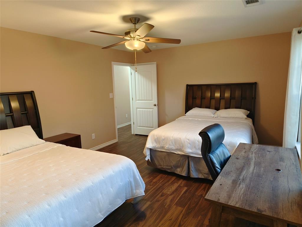 100 East Bluebonnet Drive Cresson, TX 76035 - Photo 16 of 25 Bedroom featuring dark wood-style floors and ceiling fan