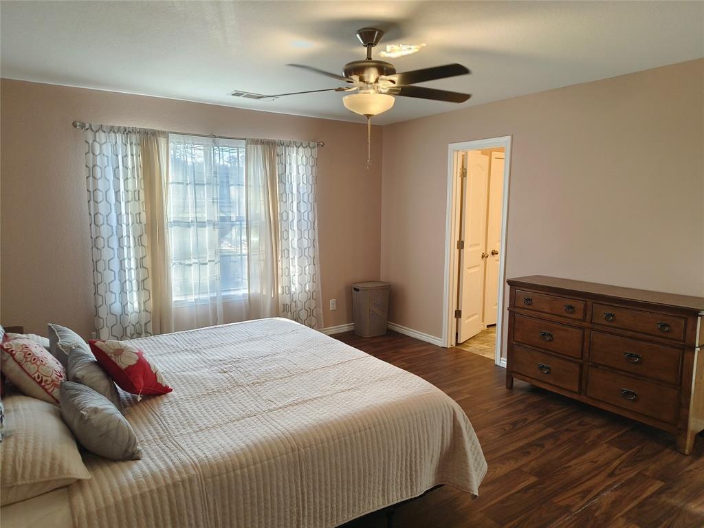 100 East Bluebonnet Drive Cresson, TX 76035 - Photo 7 of 25 Bedroom with dark wood-type flooring and a ceiling fan