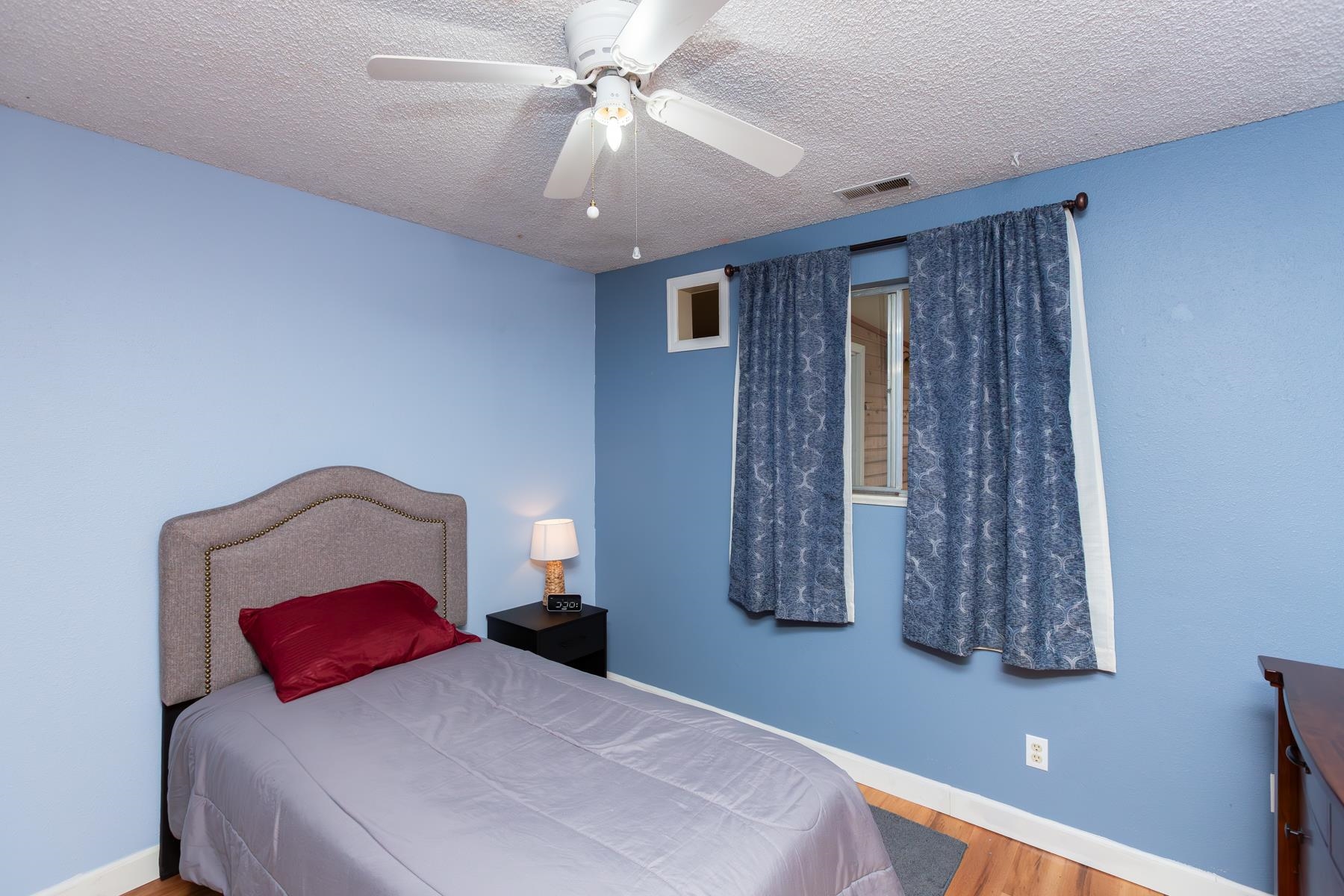 481-31 31 1/4 Road Grand Junction, CO 81504 - Photo 21 of 38 a bedroom with a large bed and a chandelier