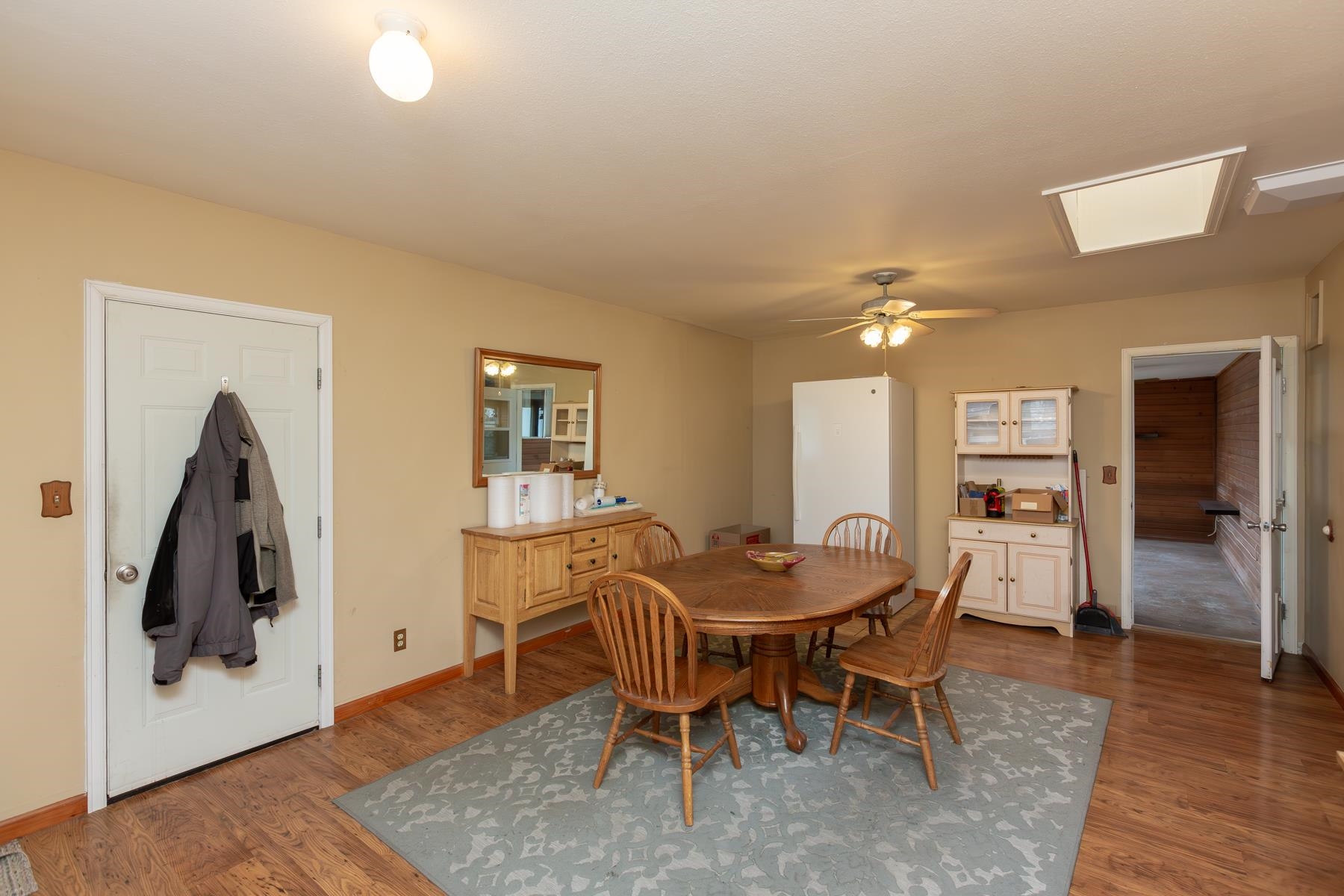 481-31 31 1/4 Road Grand Junction, CO 81504 - Photo 25 of 38 a dining room with furniture and wooden floor