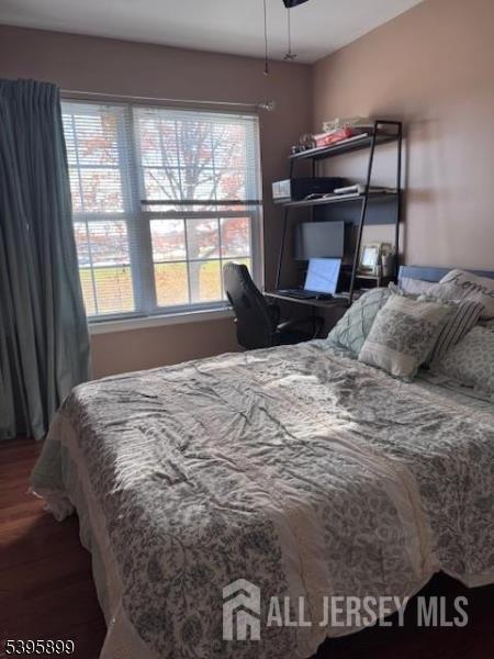 55 Edmund Street Edison, NJ 08817 - Photo 2 of 11 a bedroom with a bed and a large window