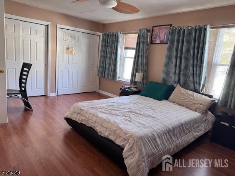 55 Edmund Street Edison, NJ 08817 - Photo 3 of 11 a bedroom with a bed and a mirror