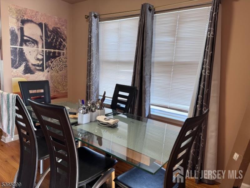 55 Edmund Street Edison, NJ 08817 - Photo 6 of 11 a view of a dining room with furniture and wooden floor