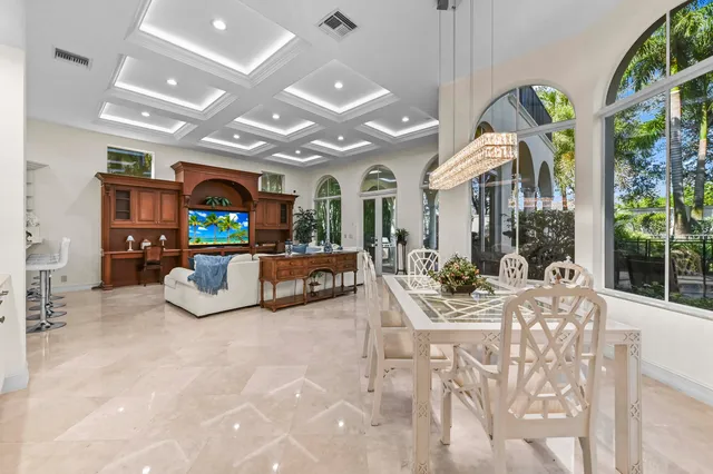 a bedroom with furniture and a flat screen tv