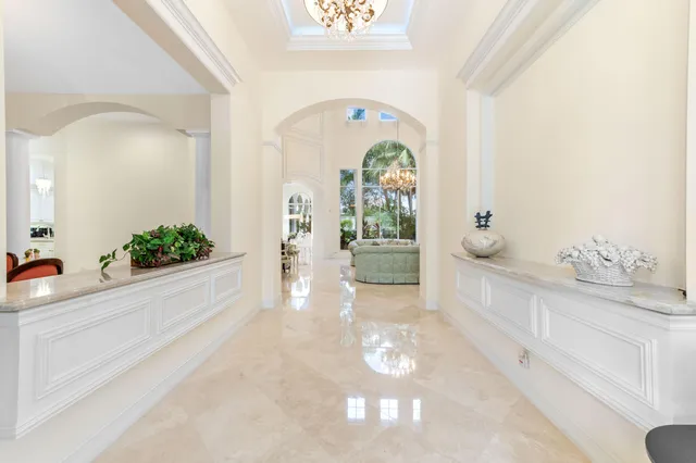 a bathroom with a granite countertop sink a large mirror and a shower