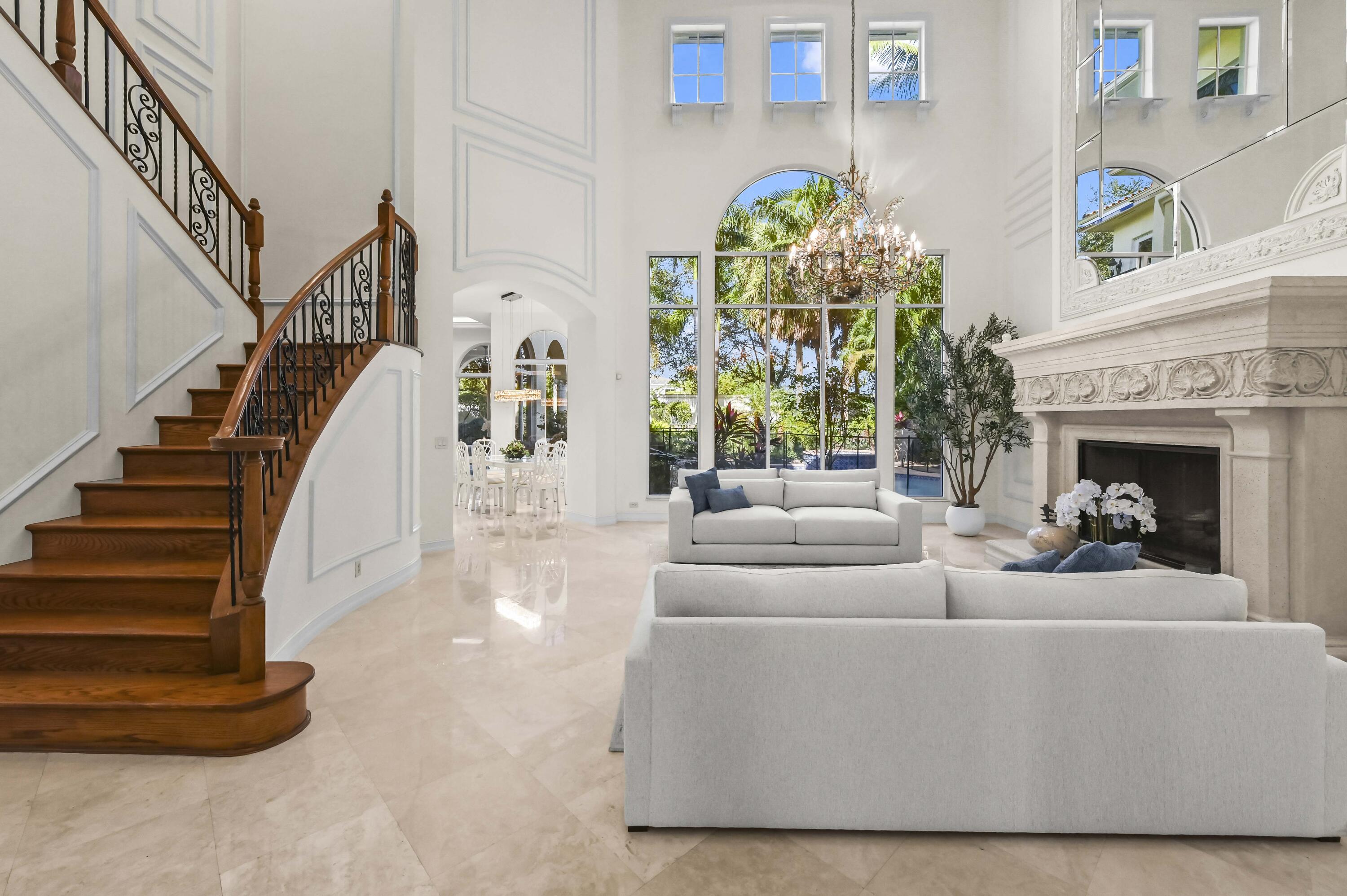 17665 Middlebrook Way Boca Raton, FL 33496 - Photo 5 of 69 a living room with fireplace furniture and a chandelier