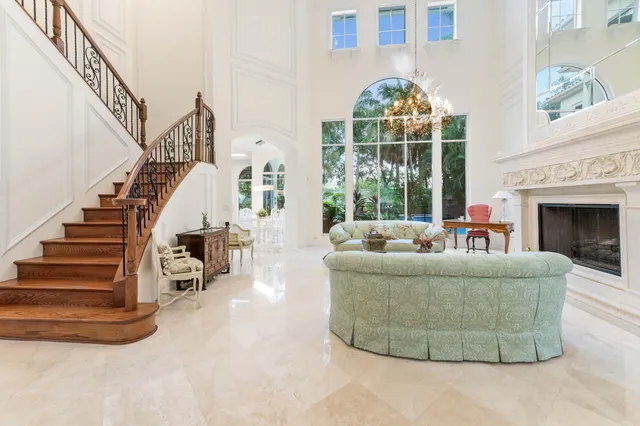 a bathroom with a toilet a sink and a mirror