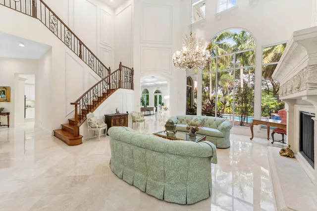 a bedroom with a bed and a flat tv screen on dresser