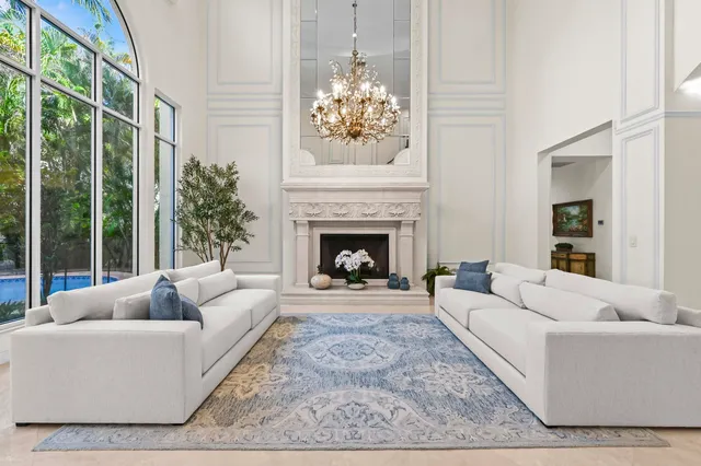 a spacious bathroom with a double vanity sink a large mirror and a bathtub