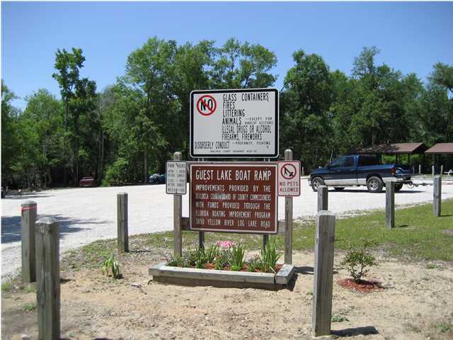 Tba Spotted Fawn Road Holt, FL 32564 - Photo 1 of 12 a view of outdoor space with sign board