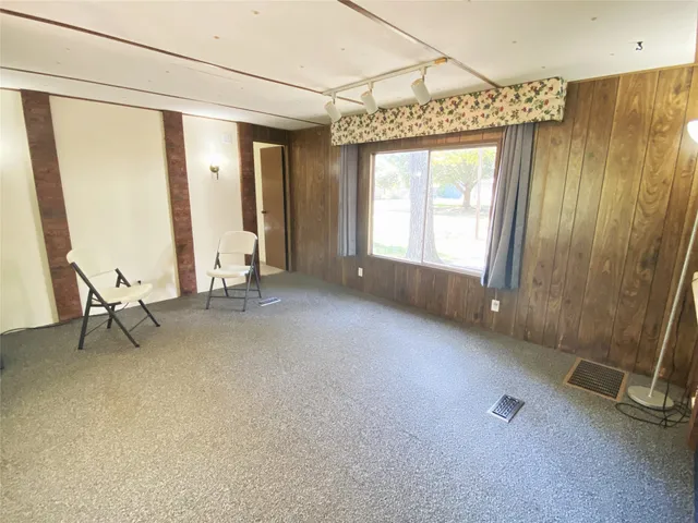 a view of a room with a porch and furniture
