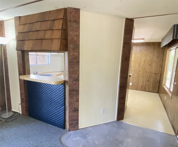 a kitchen with a stove a sink and a refrigerator