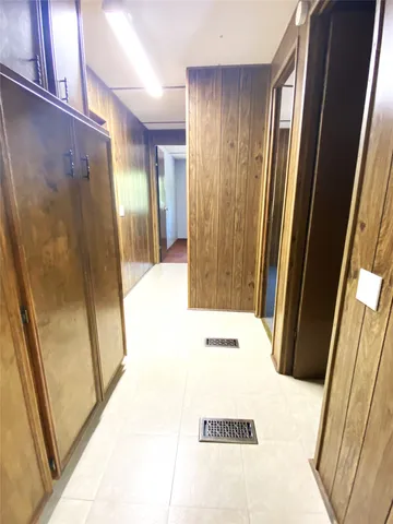 a view of hallway with a large mirror