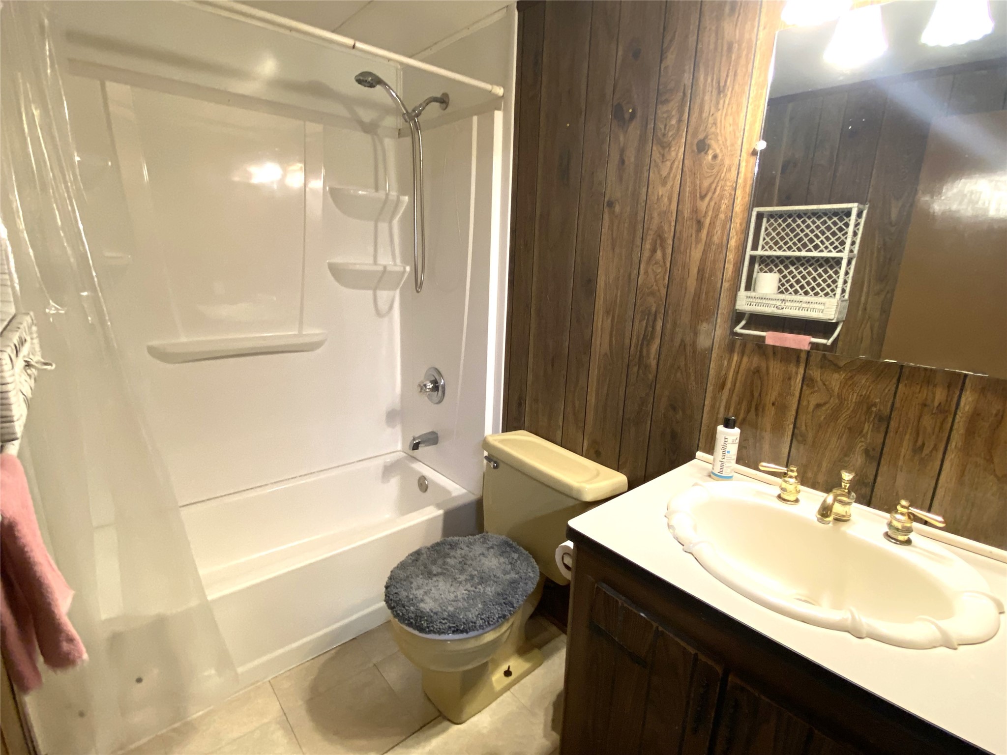 14662 Brooks Road Conroe, TX 77302 - Photo 4 of 23 a bathroom with a sink a toilet and shower
