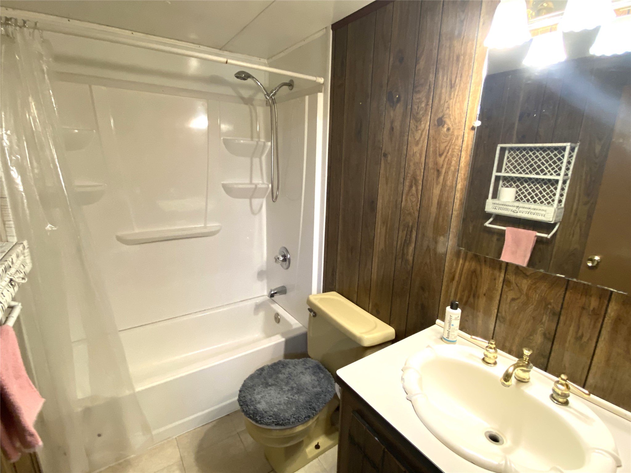 14662 Brooks Road Conroe, TX 77302 - Photo 6 of 23 a bathroom with a sink and a mirror