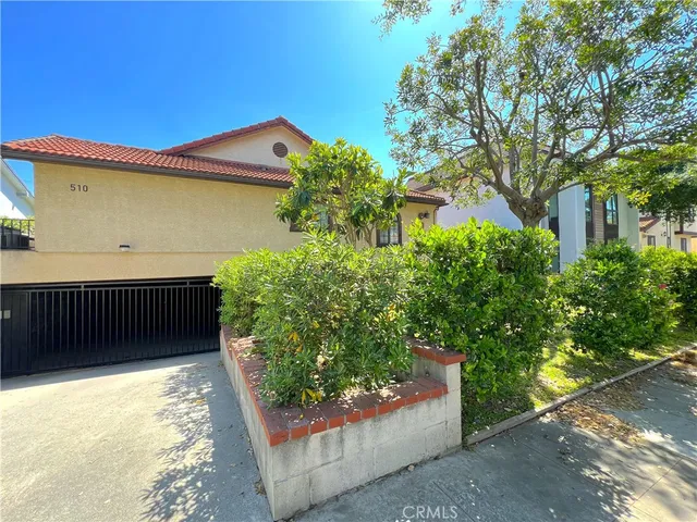 a house view with a garden space