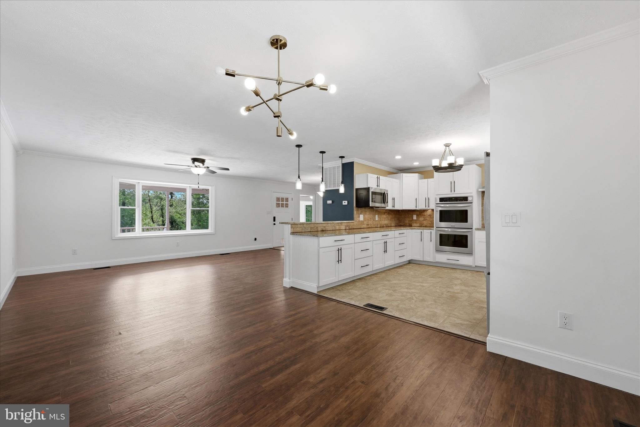 3744 Browntown Road Front Royal, VA 22630 - Photo 20 of 84 a large kitchen with cabinets wooden floor and a window