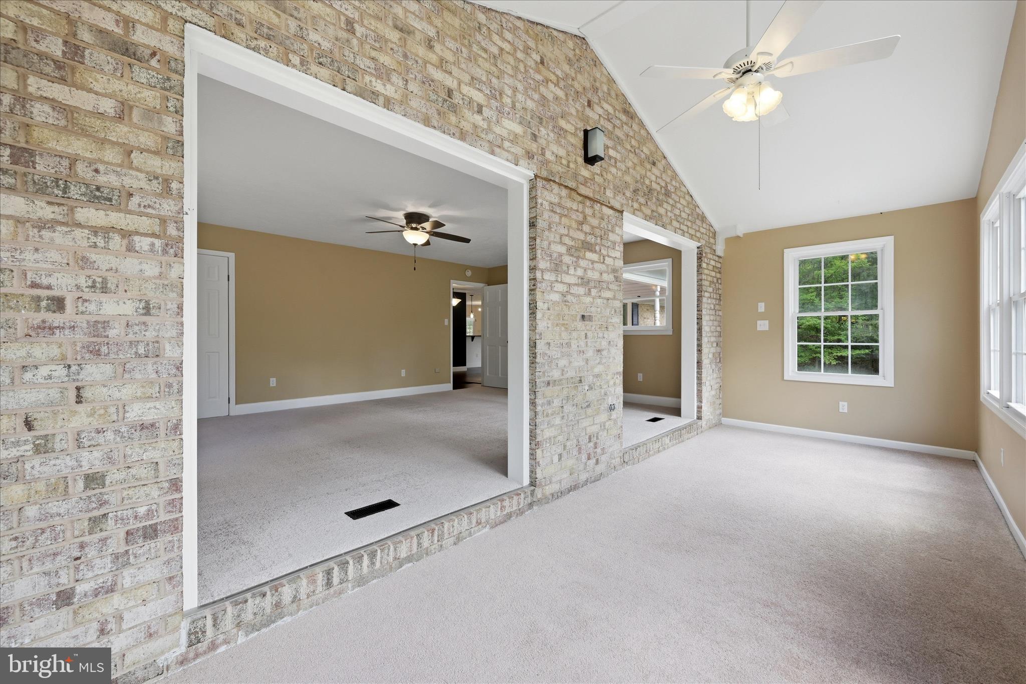 3744 Browntown Road Front Royal, VA 22630 - Photo 32 of 84 en empty room with windows and ceiling fan