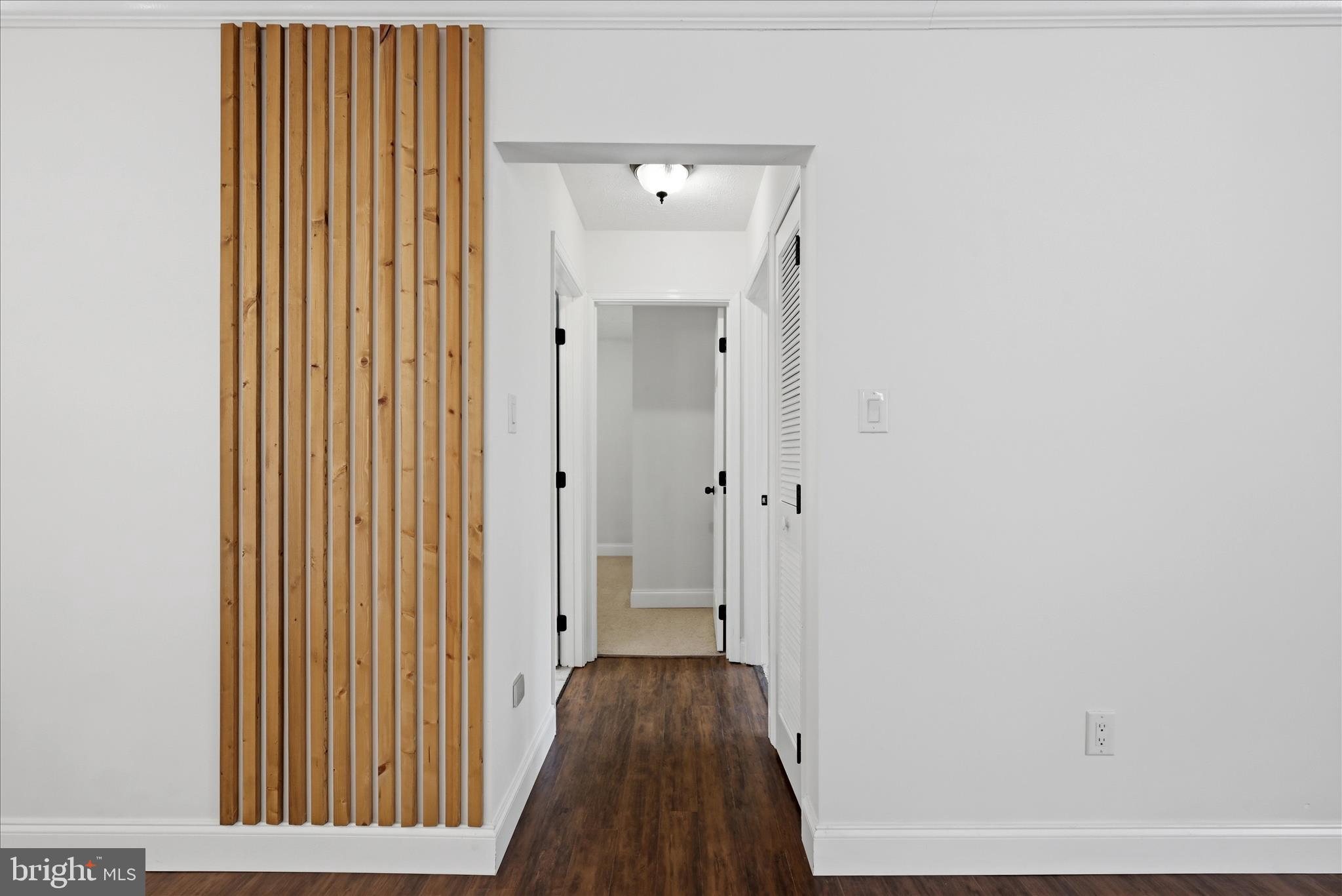 3744 Browntown Road Front Royal, VA 22630 - Photo 37 of 84 a view of a hallway with wooden floor and a bathroom
