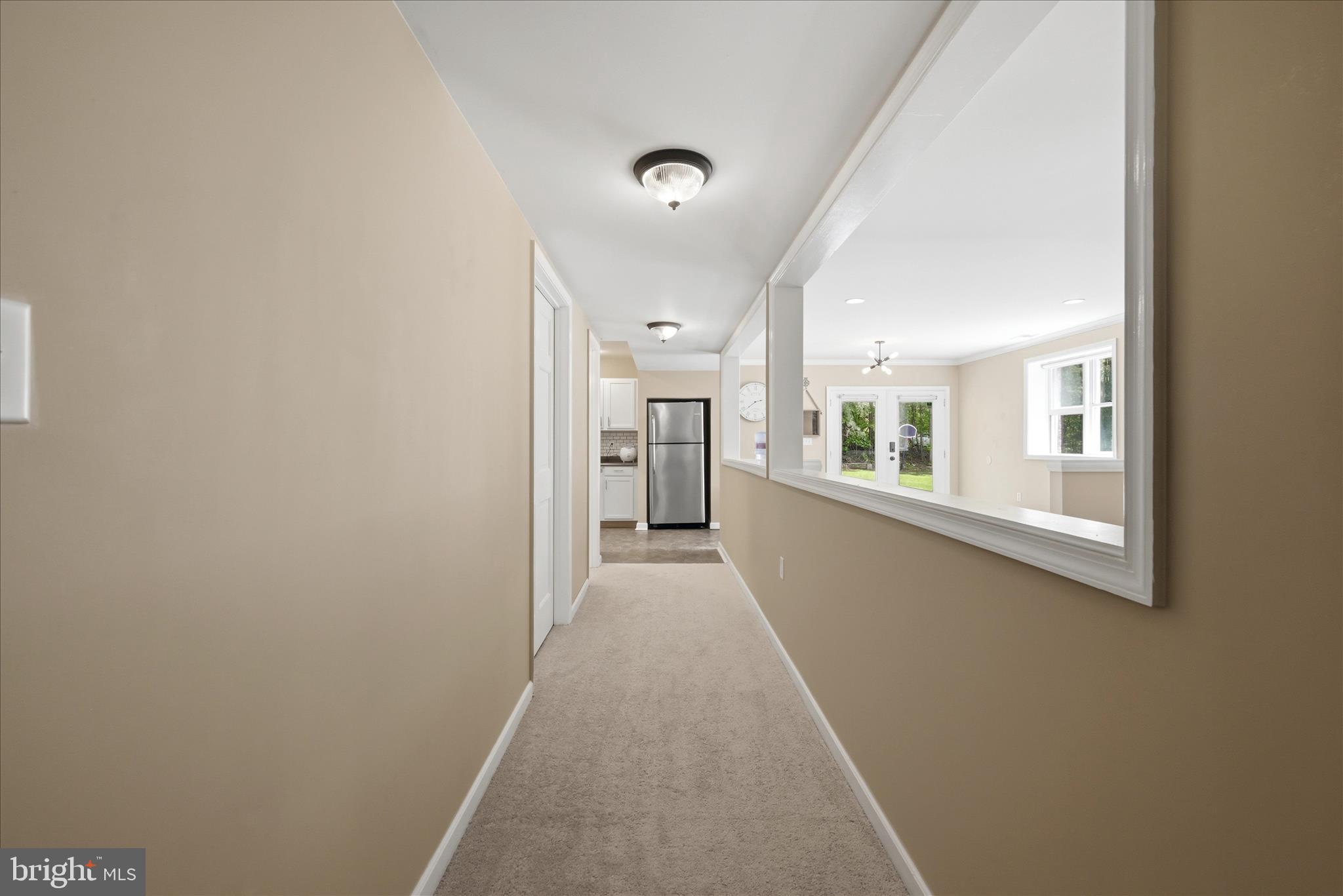 3744 Browntown Road Front Royal, VA 22630 - Photo 58 of 84 a view of a hallway with wooden floor and a window