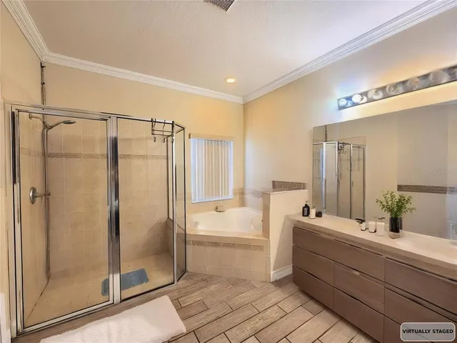 a bathroom with a double vanity sink a mirror and a shower