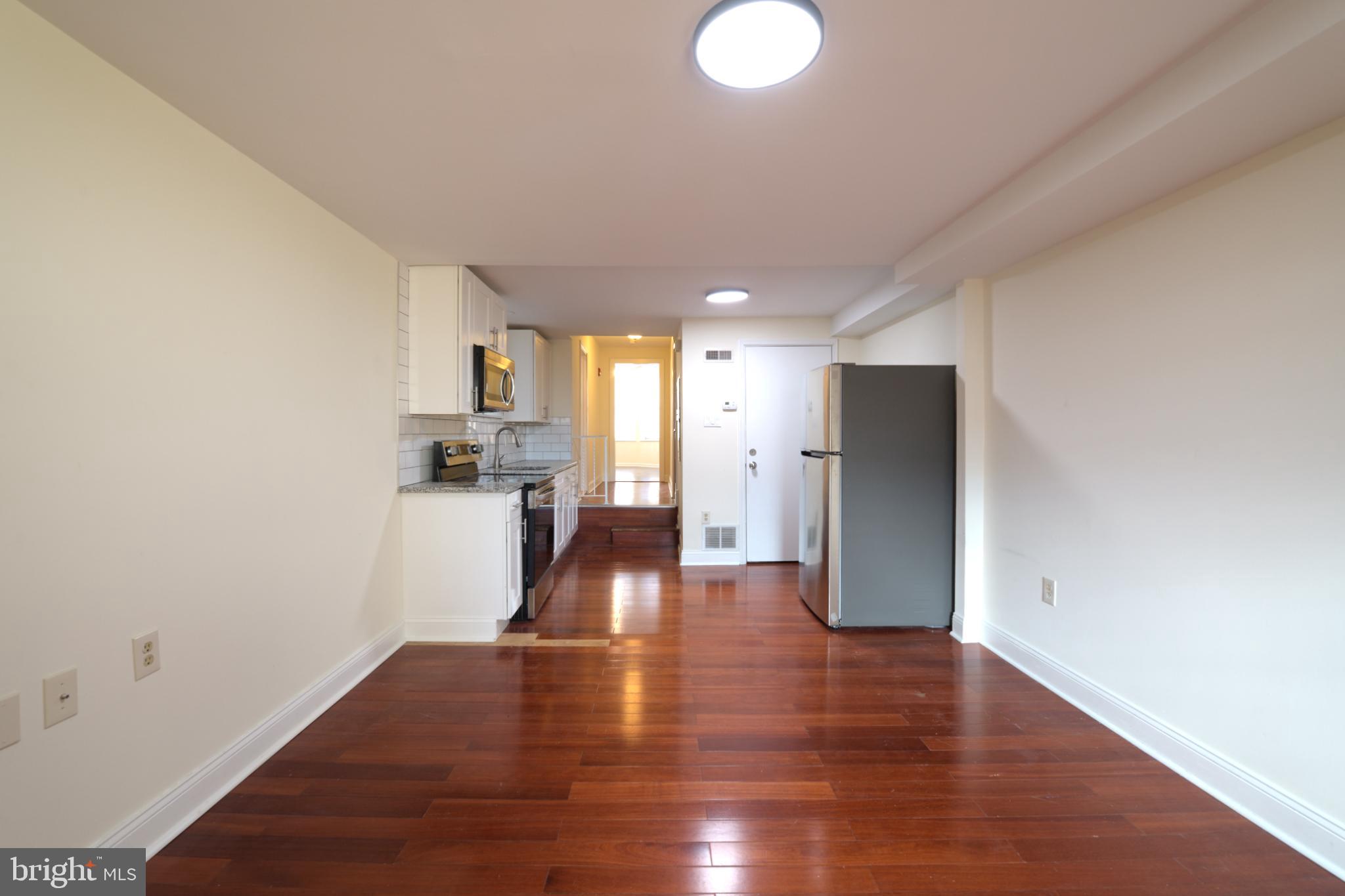 1547 South 13th Street, Unit 2&3 Philadelphia, PA 19147 - Photo 2 of 18 a view of empty room with wooden floor