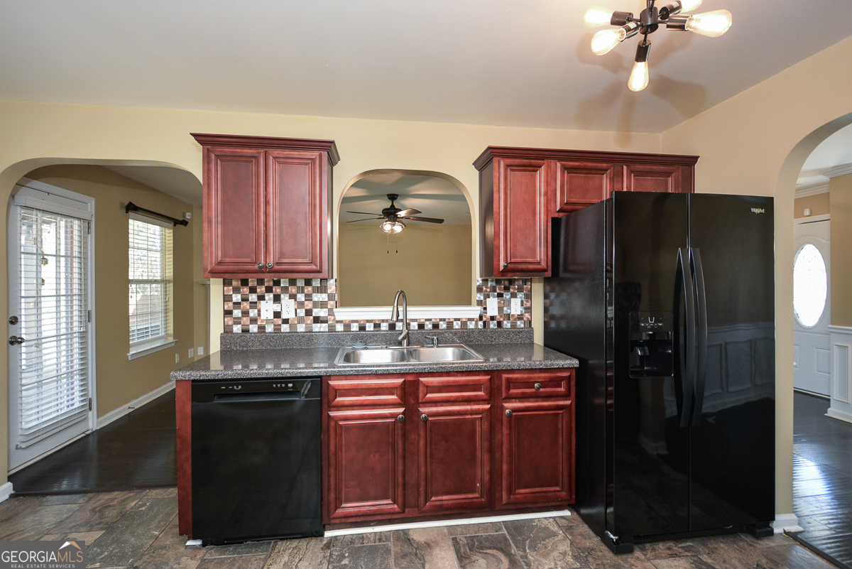 137 Baywood Crossing Hiram, GA 30141 - Photo 16 of 61 a kitchen with stainless steel appliances granite countertop a refrigerator and a stove